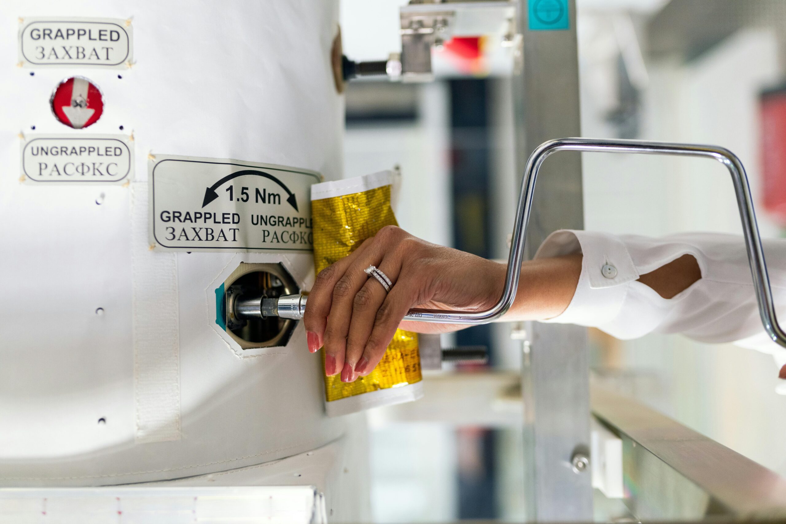 A female scientist adjusts laboratory equipment for a research experiment.